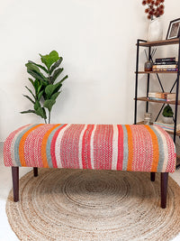 Frazada bench with striped patterns in pink and orange tones. Ideal for styling interiors and home decor purpose.