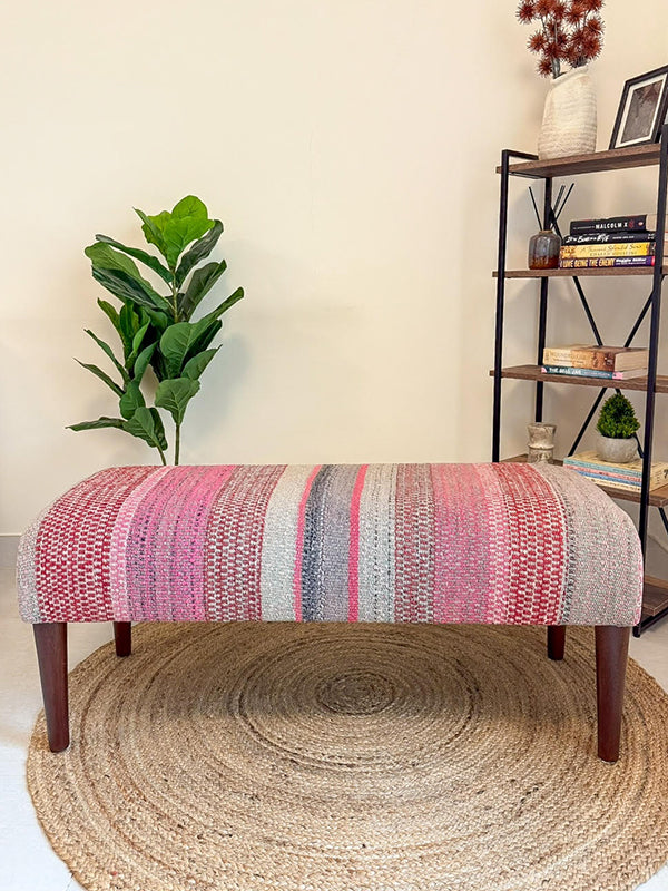 Frazada bench with striped patterns in pink tones. Ideal for styling interiors and home decor purpose.