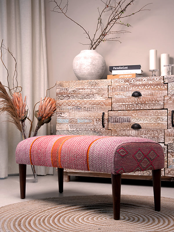 Frazada bench with striped patterns in pink and orange tones. Ideal for styling interiors and home decor purpose.