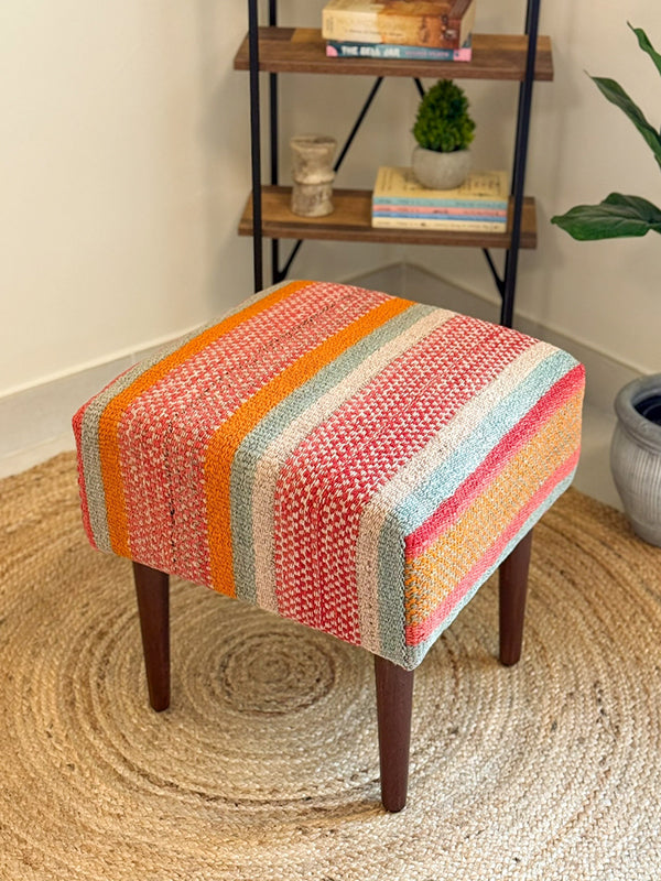 Foot stool made with alpaca wool, inspired by Andean frazada textiles and natural dyes. 
