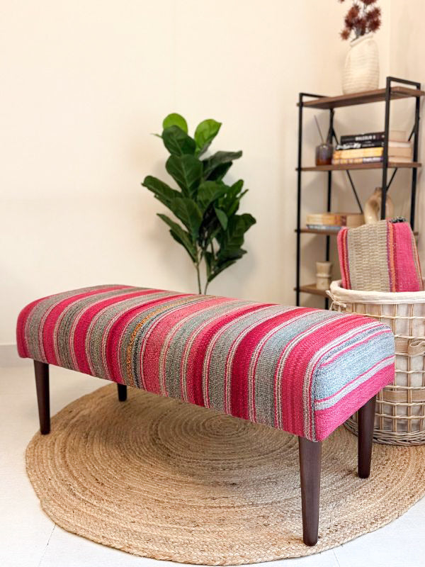 Upholstered bench featuring handwoven Andean frazada fabric with naturally dyed colors for modern home decor and interiors.