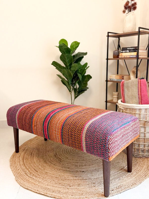 Upholstered bench featuring handwoven Andean frazada fabric with naturally dyed colors for modern home decor and interiors.