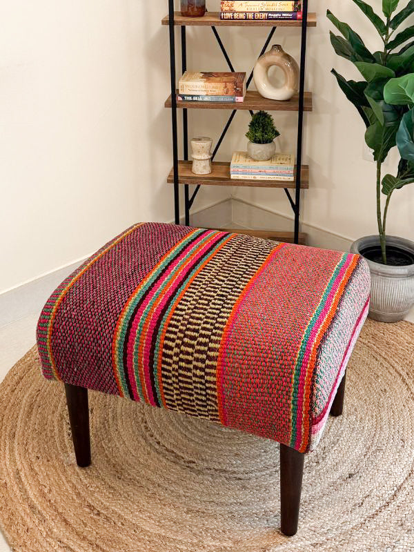 Upholstered bench featuring handwoven Andean frazada fabric with naturally dyed colors for modern home decor and interiors.