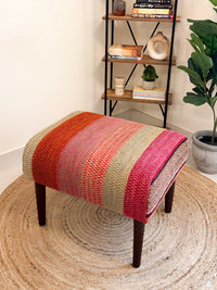 Upholstered bench featuring handwoven Andean frazada fabric with naturally dyed colors for modern home decor and interiors.